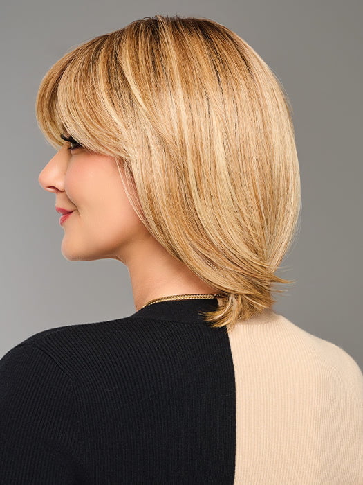 Model is wearing TIMELESS CHARM by RAQUEL WELCH in color  RL14/22SS SHADED WHEAT | Dark Blonde Evenly Blended with Platinum Blonde with Dark Roots