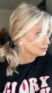 Emily H. @she_sheds_more wearing RACHEL by JON RENAU in color 101/88/27S8 CATALINA BLONDE | Pale blonde with Pure White Natural Violet halo highlights, shaded medium brown (styled)