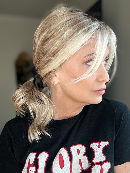 Emily H. @she_sheds_more wearing RACHEL by JON RENAU in color 101/88/27S8 CATALINA BLONDE | Pale blonde with Pure White Natural Violet halo highlights, shaded medium brown (styled)