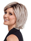 Model is wearing RAZOR CUT SHAG by TRESSALLURE in color 56/60/R8 | Lightest Grey Blend Rooted Medium Brown