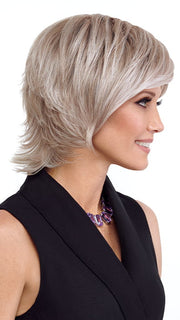 Model is wearing RAZOR CUT SHAG by TRESSALLURE in color 56/60/R8 | Lightest Grey Blend Rooted Medium Brown