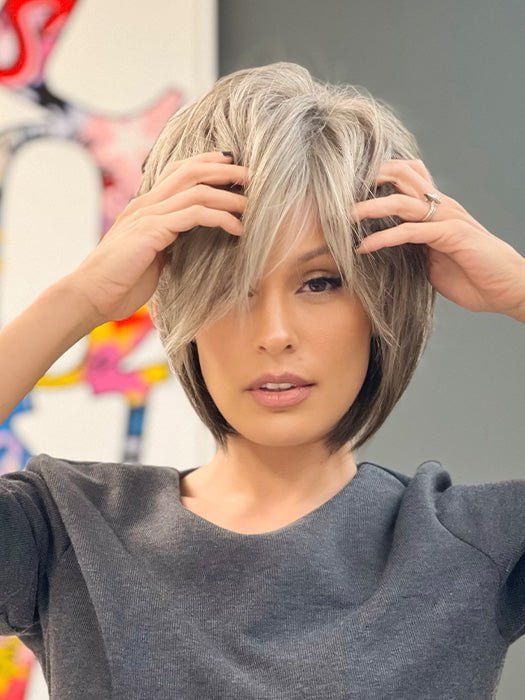 Roxie wearing REESE by NORIKO in SANDY SILVER | Medium Brown Transitionally Blending to Silver and Dramatic Silver Bangs