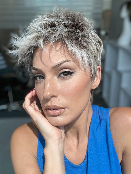 Model is wearing CHAT by ELLEN WILLE in color PEARL ROOTED | Pearl Platinum with Medium Ash Blonde and Lightest Brown with Grey Blend and Shaded Roots