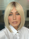 Model is wearing PAIGE by ENVY in color SILKY BEIGE | Light Platinum Blonde with Dark Brown Roots