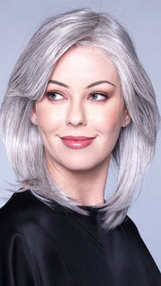 A layered haircut paired with curtain bangs 