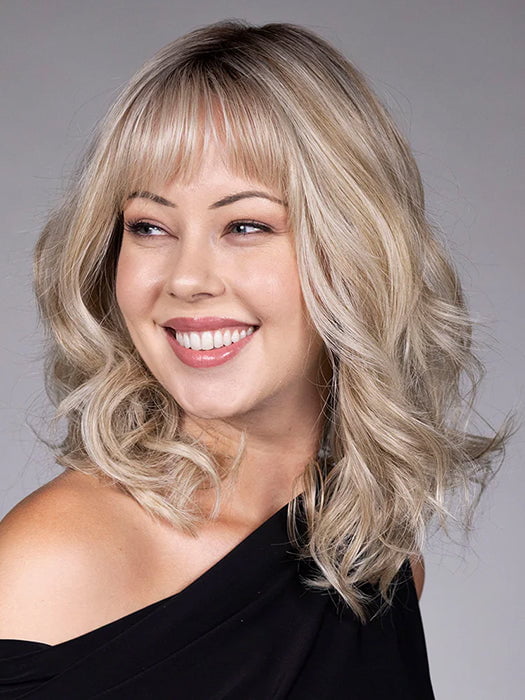 Model is wearing SIMONE in color BUTTERBEER R | Dark Brown Base and Root that transitions smoothly into a buttery blonde, infused with creamy honey and toffee tones