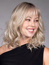 Model is wearing SIMONE in color BUTTERBEER R | Dark Brown Base and Root that transitions smoothly into a buttery blonde, infused with creamy honey and toffee tones