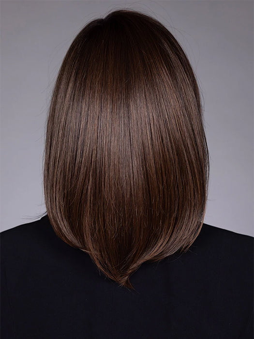 Model is wearing STREISAND in SOFT AMBER BROWN R | A warm rooted, amber-toned shade blending golden and red hues over a medium brown base.