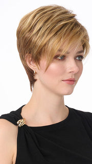 Model is wearing SHARI by ENVY in color GOLDEN NUTMEG | Medium Brown roots with overall Warm Cinnamon base and Golden Blonde highlights