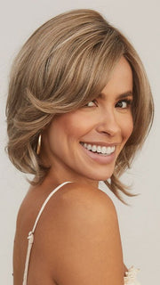 Model is wearing SHEENA by RENE OF PARIS in color CHAMPAGNE SUNSET | Dark/medium multi-tonal blond with textured honey, ash, and golden hues and chocolate brown roots