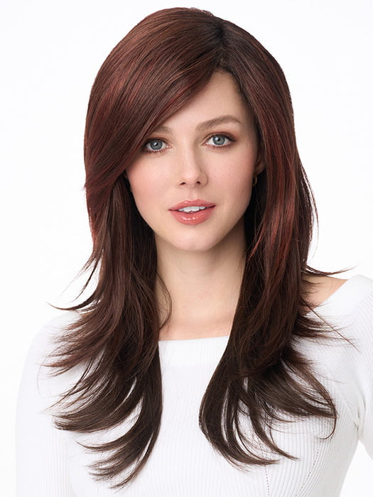 Model is wearing SHEENA by ENVY in color CHOCOLATE CHERRY | Dark Brown roots with overall Medium Brown base with Deep Red highlights