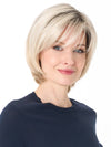 Model is wearing SHEILA by ENVY in color PLATINUM SHADOW | Light Blonde with Dark Roots