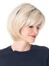 Model is wearing SHEILA by ENVY in color PLATINUM SHADOW | Light Blonde with Dark Roots