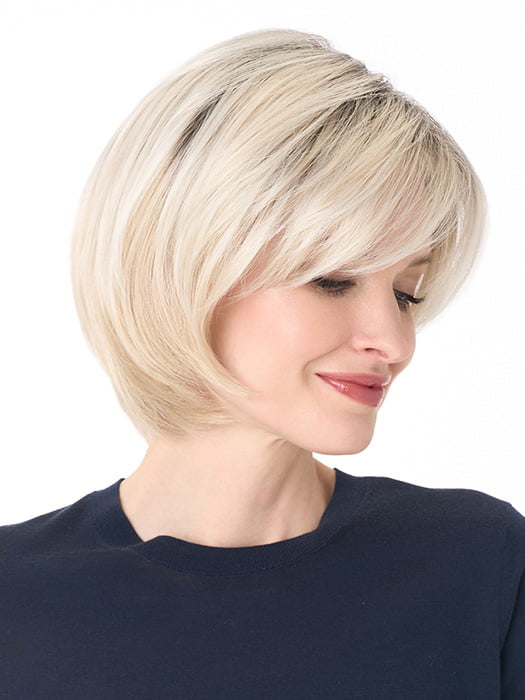 Model is wearing SHEILA by ENVY in color PLATINUM SHADOW | Light Blonde with Dark Roots