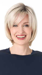 Model is wearing SHEILA by ENVY in color PLATINUM SHADOW | Light Blonde with Dark Roots