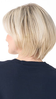 Model is wearing SHEILA by ENVY in color PLATINUM SHADOW | Light Blonde with Dark Roots