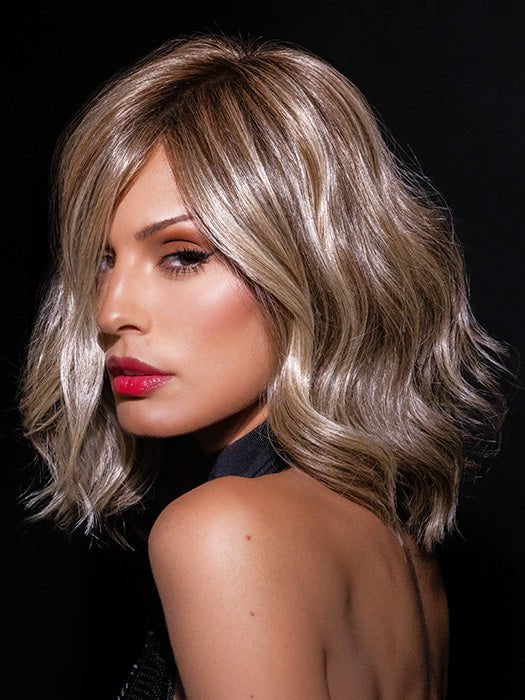 Roxie wearing SIMMER ELITE PETITE by RAQUEL WELCH in RL12/22SS SHADED CAPPUCCINO | Light Golden Brown Evenly Blended with Cool Platinum Blonde Highlights with Dark Roots