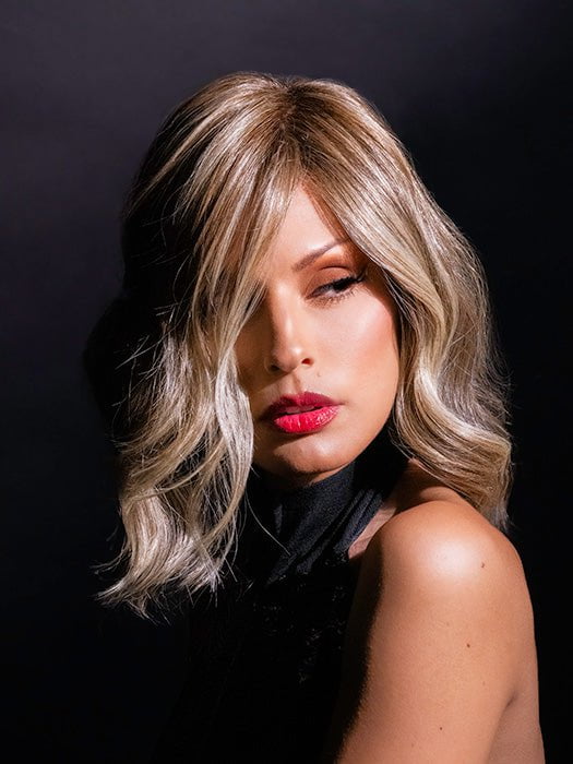 Roxie wearing color RL12/22SS SHADED CAPPUCCINO | Light Golden Brown Evenly Blended with Cool Platinum Blonde Highlights with Dark Roots