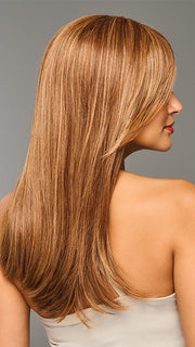 Model is wearing SLEEK SOPHISTICATION by RAQUEL WELCH in color RL30/27 RUSTY AUBURN | Medium Auburn Evenly Blended with Strawberry Blonde