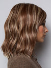 Model is wearing SMOOTH WAVEZ in color SNOWY UMBER R | Medium Ginger Brown base with White Blond highlights