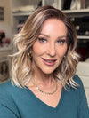 Eileen @crazywiglady is wearing SMOOTH WAVEZ by RENE OF PARIS in color MELTED-MARSHMALLOW | Subtly warm dark sandy blonde blend with medium brown roots and light ash blonde tips and highlights
