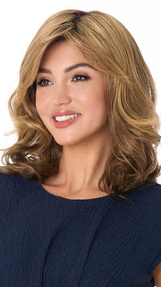 Model is wearing SONIA by ENVY in color TOASTED SESAME | Medium Brown roots with overall Warm Cinnamon base and Golden Blonde highlights