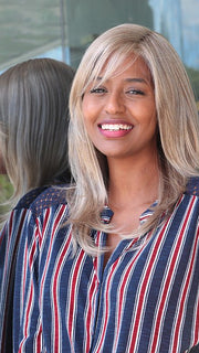 sophia wearing color R1621S+ GLAZED SAND | Dark Natural Blonde with Cool Ash Blonde Highlights on Top