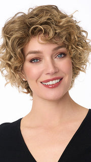 Model is wearing SUZI by ENVY in color FROSTED | Light Brown with Wheat Blonde blended highlights