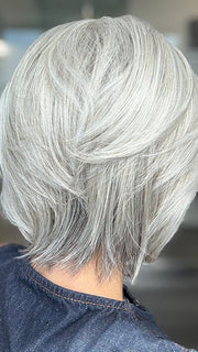 Model is wearing TAILORED ALLURE by RAQUEL WELCH in color TAILORED ALLURE in color RL51/61 ICED GRANITA | Lightest Grey Progresses to a Deep Grey at the Nape