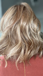 Emily H. @she_sheds_more wearing TERESA by BELLE TRESS in color CARAMEL TOFFEE BLONDE-R | Toffee is a warm, dimensional shade blending medium brown with golden blonde and caramel highlights. Softly rooted for a natural, sun-kissed finish.