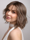 Terra by Amore in color BRONDE-R | Dark brown and natural medium blond tones are mixed together and shaded with medium dark brown roots for a realistic appearance.