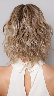 Model is wearing Terra by Amore in color SEA SALT BLOND R | A perfect mixture of cool, icy-blond and warm-dark blond. The rich brown root tone enhances the modern appearance