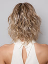 Model is wearing Terra by Amore in color SEA SALT BLOND R | A perfect mixture of cool, icy-blond and warm-dark blond. The rich brown root tone enhances the modern appearance