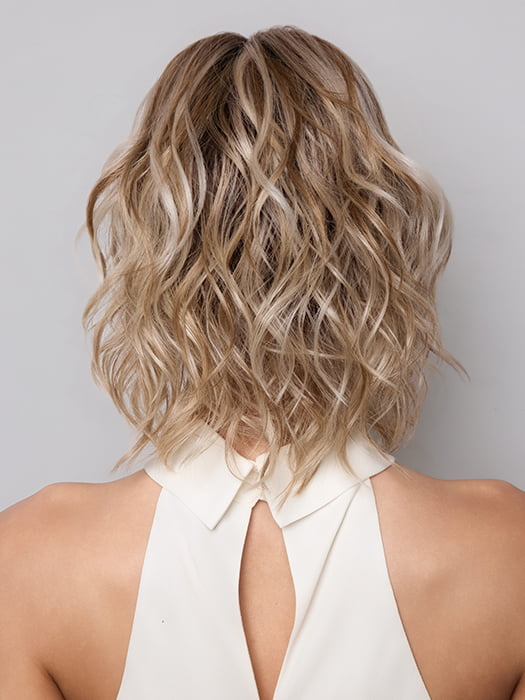 Model is wearing Terra by Amore in color SEA SALT BLOND R | A perfect mixture of cool, icy-blond and warm-dark blond. The rich brown root tone enhances the modern appearance