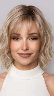 Model is wearing Terra by Amore in color SEA SALT BLOND R | A perfect mixture of cool, icy-blond and warm-dark blond. The rich brown root tone enhances the modern appearance