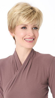 Model wearing TIFFANY by ENVY in SPARKLING CHAMPAGNE | Medium Brown roots with overall Strawberry Blonde base and soft Golden Blonde highlights