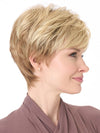 Model is wearing TIFFANY by ENVY in color SPARKLING CHAMPAGNE | Medium Brown roots with overall Strawberry Blonde base and soft Golden Blonde highlights