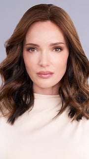 This hair topper's lightweight front gradually transitions to medium coverage at the crown and back