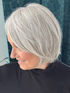 Mel B. @mels.be.ageless wearing Top Billing 8" by Raquel Welch in color RL56/60 SILVER | Lightest Gray Evenly Blended with Pure White
