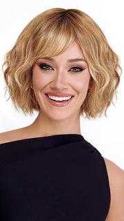 Model is wearing TREND by TRESSALLURE in color 14/26/R10 | Red Blonde with Gold Blonde Highlights and Light Brown Roots