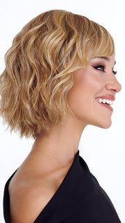 Model is wearing TREND by TRESSALLURE in color 14/26/R10 | Red Blonde with Gold Blonde Highlights and Light Brown Roots