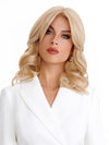 Model is wearing the MILLION DOLLAR BABE by TressAlure in color 22R | Dark Golden Blonde