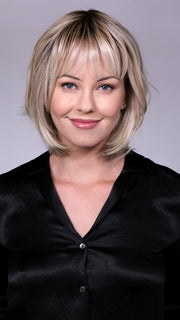 Model is wearing TRIBECA By BELLETRESS in CRUSHED-ALMOND-BLONDE-R | A Soft Neutral Light Blonde with a Light and Medium Blended Root Color