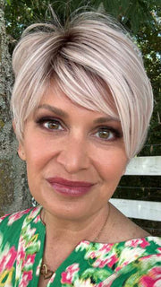 Emily H. @she_sheds_more wearing LINK by ELLEN WILLE in color PASTEL ROSE ROOTED | Pink and Pearl Blonde Blend with Light Brown Roots
