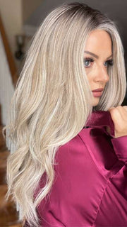 Sandy @i_be_wiggin wearing LONG TOUSLED WAVES by HAIRDO in color SS19/23 SHADED BISCUIT | Cool Platinum Blonde with subtle highlights and Medium Brown roots