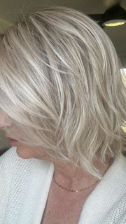 Emily H. @she_sheds_more wearing Alicante by BelleTress in shade CRUSHED ALMOND BLONDE R | A soft Neutral Light Blonde with a Light and Medium Blended Root Color.