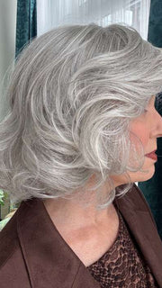 Mel B. @mels.be.ageless wearing CROWD PLEASER by RAQUEL WELCH WIGS in color RL56/60 SILVER MIST | Lightest Gray Evenly Blended with Pure White
