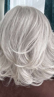 Mel B. @mels.be.ageless wearing CROWD PLEASER by RAQUEL WELCH WIGS in color RL56/60 SILVER MIST | Lightest Gray Evenly Blended with Pure White
