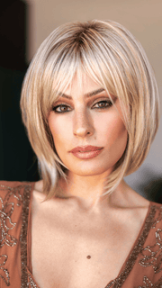 Model is wearing ALVA by NORIKO in ARABIAN SAND™ | Neutral Chocolate Brown Roots fade into a Neutral Blonde Base, blended with Sandy, Chestnut, Golden, and Honey Blondes, with Soft Creamy Blonde Highlights and Face-Framing Lowlights