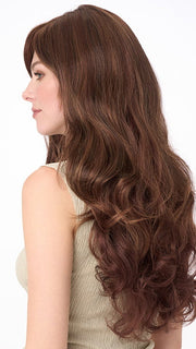 Model is wearing WENDI by ENVY in color CINNAMON-RAISIN | Medium Brown with Auburn and Cinnamon highlights